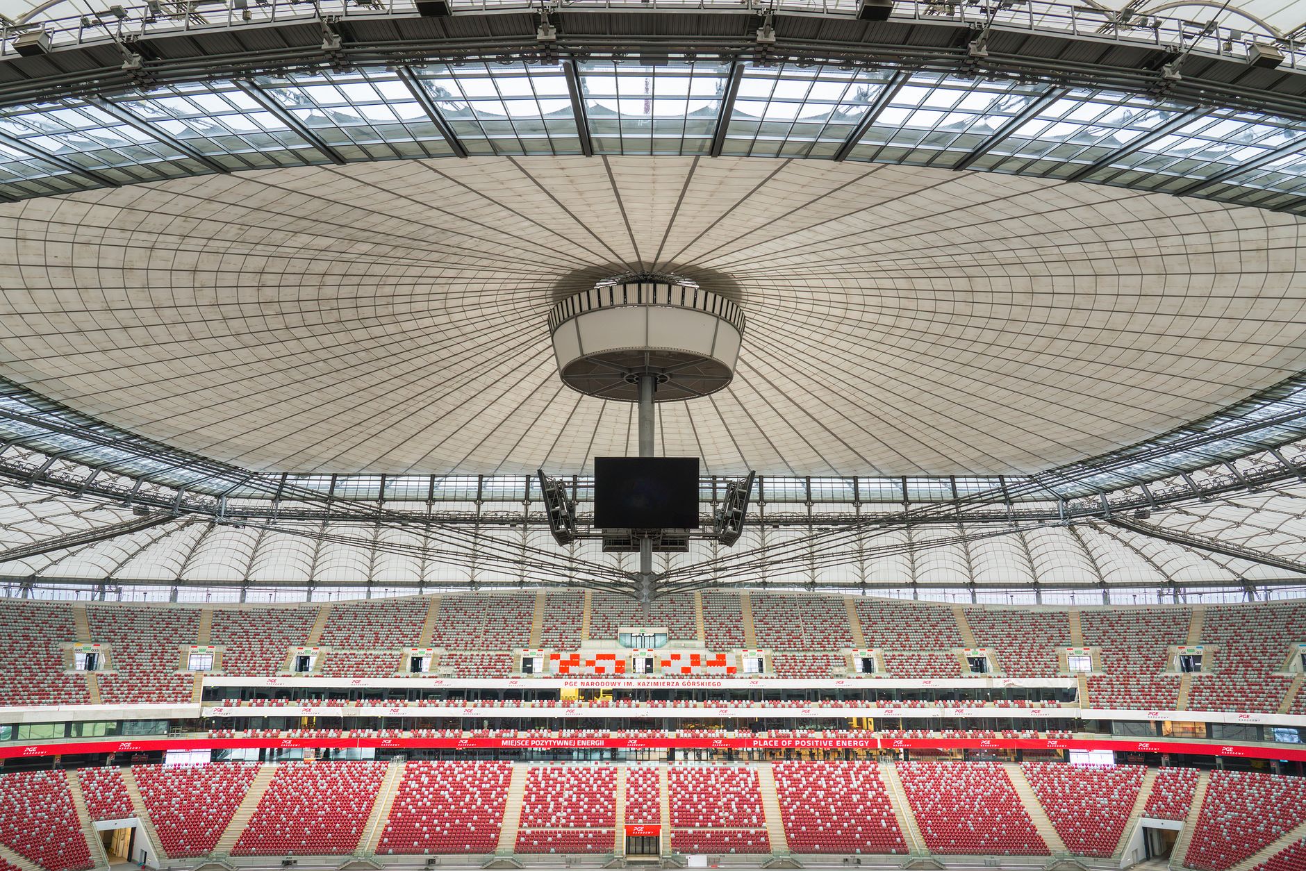 View of Warsaw's National Stadium showcasing its iconic roof design and vibrant seating.