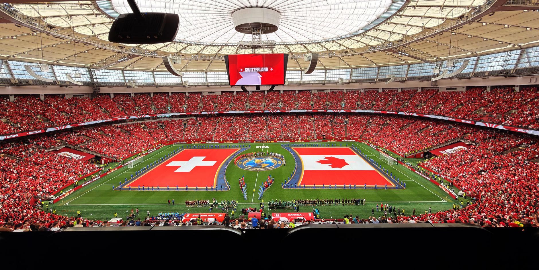 A vibrant soccer match between Switzerland and Canada in BC Place, Vancouver.