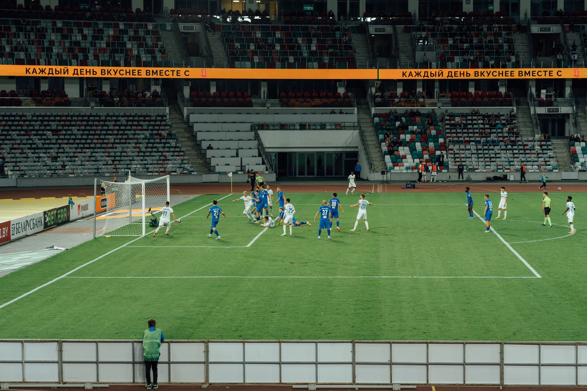Exciting soccer match captured during day at a modern stadium.