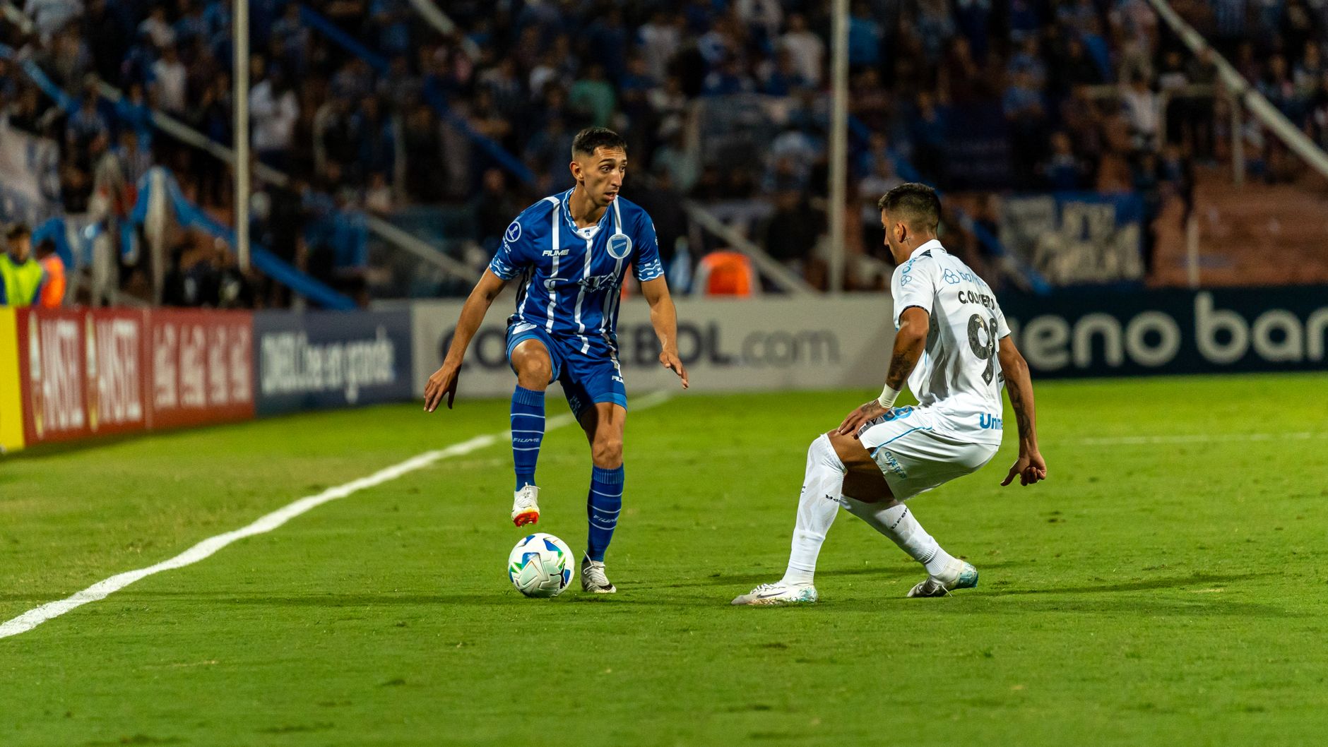 Dramatic moment during a football match with players in action on the field.
